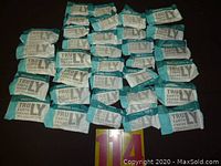 Overview of multiple Truly Earth Friend Spa Collection bars arranged in rows showed many facial and massage bars in their packaging.