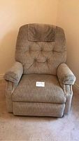 Front view of tufted fabric recliner