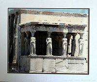 Framed photographic print showing the caryatid columns on a historic building, signed by Peter Li, with clear details of the sculpture and stonework.