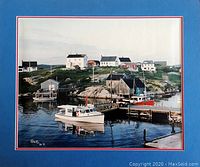 Signed photograph showing coastal village with wooden docks and boats, Peter Li signature visible.