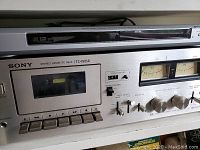 Close-up of Sony stereo cassette deck TC-188SD and Sony DVD player above it.