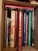 Box of books including titles about canoes, brewing, fishing, and Canadian railroads.
