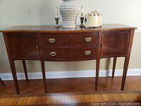 Full front view of bow-front sideboard console