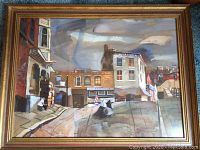Full view of framed watercolor painting showing urban street scene