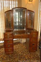Full front view of Lexington vanity showing tri-fold mirror and all drawers.