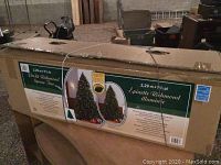 Box with label showing the pre-lit Richmond Spruce Christmas tree, height 2.29 m / 7.5 ft.
