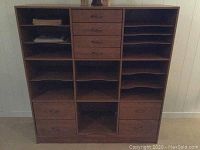 Front view of entire cabinet showing drawers and shelves