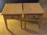 Pair of birdseye maple side tables shown front view revealing tops, legs and drawer fronts