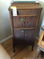 Front view of closed oak cabinet