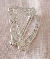 Front view of the vintage sterling silver Celtic Irish harp pin showing intricate openwork detail.