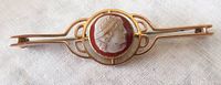 Front view of Victorian 9CT yellow gold cameo bar pin showing cameo profile and gold setting.
