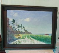 Full view of framed oil painting showing rural farm landscape with dirt path, trees, grassy fields, and red tractor on horizon.