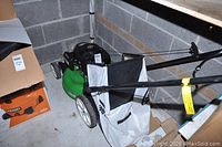 Left-front view of mower in storage with bag attached