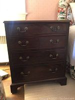 Front view of chest showing four drawers and hardware