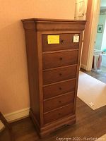 Front view of entire lingerie chest showing seven drawers and top molding