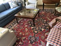 Overall view of rug under living room furniture