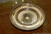 Top-down view showing entire bowl interior and embossed border motifs