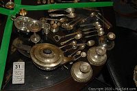 Full assortment of sterling silver items including teapot, gravy boat, spoons, candlesticks, compote, cup and overlay glasses