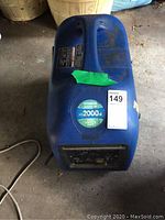 Top-front view of blue generator showing model labels and overall condition