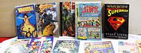 Image of selected comic books from the lot, showing varied titles such as Vampirella, Superman, Jinx the Giant Killer and The Death and Life of Superman graphic novel.