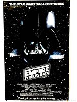 Full view of the black Star Wars Empire Strikes Back poster showing Darth Vader helmet and star filled background with text at top and center.