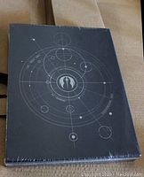 Front cover of the boxed and sealed limited edition hardcover book featuring Star Wars Jedi theme design.