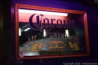 Front view of Corona Extra mirror showing logo and frame