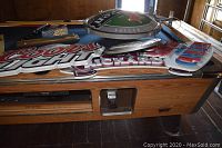 Overview of all five beer promotional signs laid on table, showing shapes and layering