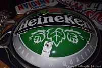 Front view of round Heineken logo on illuminated sign