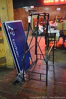 Disassembled frame and two table top panels leaning against frame