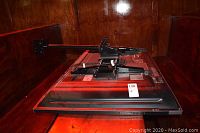 Rear view of TV laid face down showing integrated swivel mount arm attached to back panel