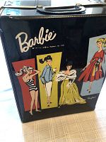 Black vinyl carrying case exterior with Barbie logo and illustrations