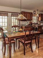 Front view of dining table and chairs in kitchen setting