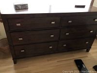 Front view of Bassett Ventura dresser showing six drawers and silver recessed handles.