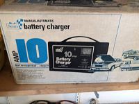 Photo of the original box with image of battery charger and detailed blue and white lettering