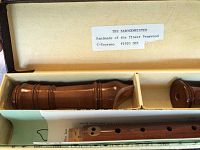 Close-up of the inside of the case with pearwood recorder parts, label stating Handmade of the finest Pearwood, C-Soprano #1920 DHP