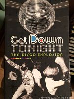 Front cover of the disco music CD collection featuring a large disco ball and dancing people from the disco era.