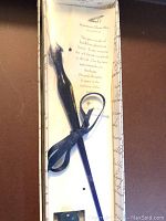 Venetian glass dip pen in original box with ribbon tied around it.