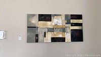 Full view of the rectangular wall art painting showing abstract geometric shapes in black, beige, and grey.