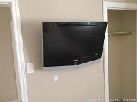 Front view of the 31-inch Samsung TV mounted on wall