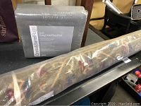 Crate & Barrel Easy Hold rug pad in packaging, labeled 5'x8', gray color, new condition.