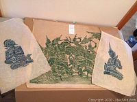 Three vintage presumed Thai temple rubbings on thin rice paper, two smaller and one larger.