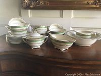 Full set of J. & G. Meakin Westminster English china pieces arranged showing soup bowls, underplates, serving bowl, covered sugar bowl, cream jug, and gravy boat.