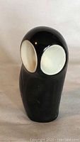 Front view of the black and white Royal Dux owl figurine showing eye details and smooth finish