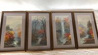 All four framed and matted watercolour paintings displayed side by side