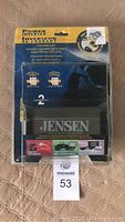 Front view of Jensen power inverter in original blister packaging showing brand and key features.