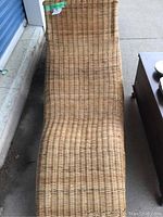 Front angle of the IKEA wicker lounge chair showing seat and backrest contour and weaving detail