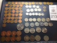 Overall lot showing multiple rows of British coins including copper pennies, shillings, florins, and crown coins.