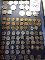 Overview of all coins displayed in tray