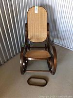 Full view of vintage bentwood rocking chair with detached middle support piece in front.